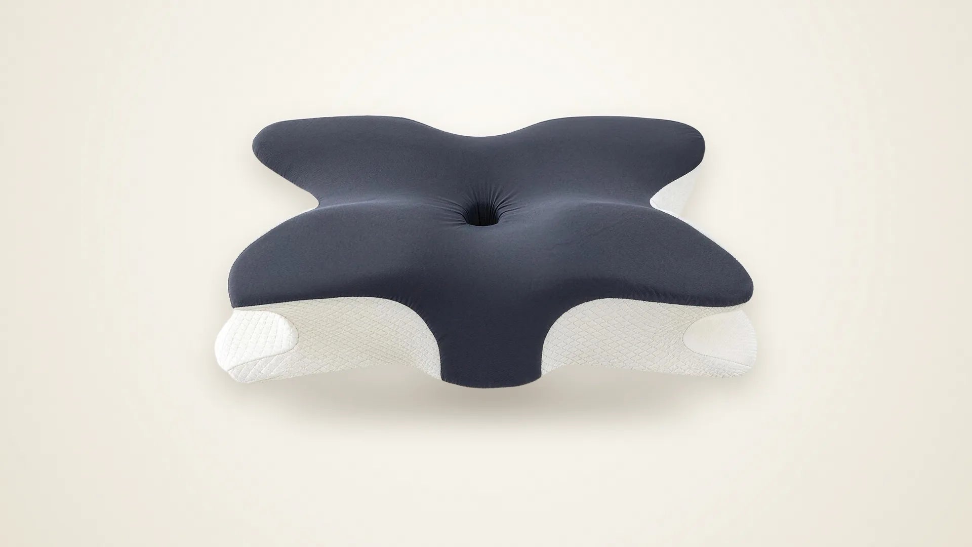 The SleepSculpt pillow in Dark Grey on a warm studio backdrop